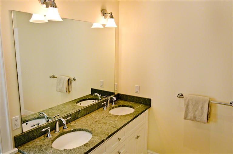 4 Magnolia Way Edgartown, MA 02539 - Photo 15 of 23 a bathroom with a granite countertop sink and a mirror