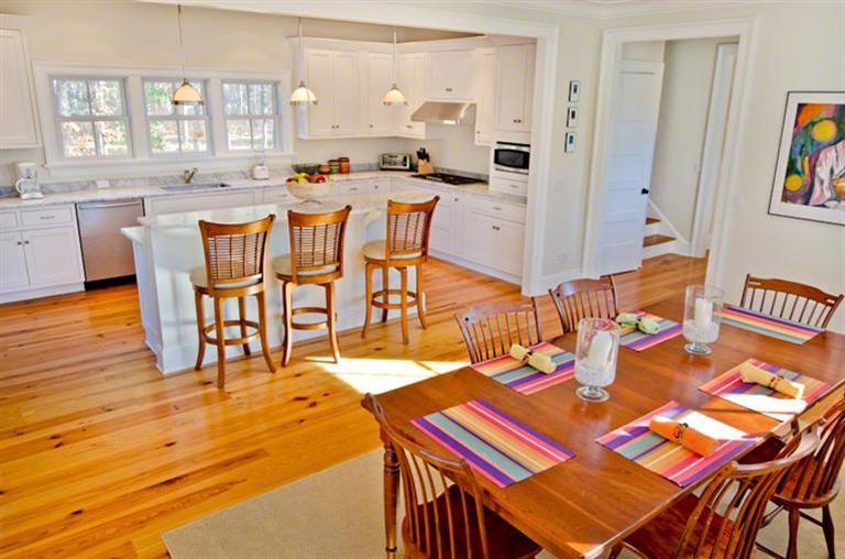 4 Magnolia Way Edgartown, MA 02539 - Photo 6 of 23 a dining room with furniture and wooden floor
