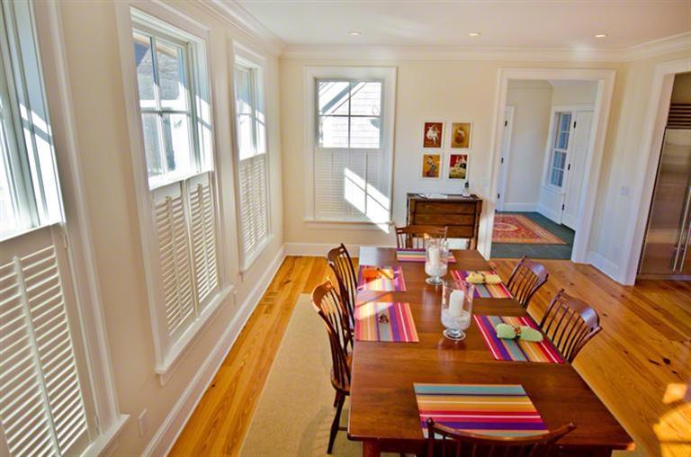 4 Magnolia Way Edgartown, MA 02539 - Photo 7 of 23 a balcony view with a dining table and chairs