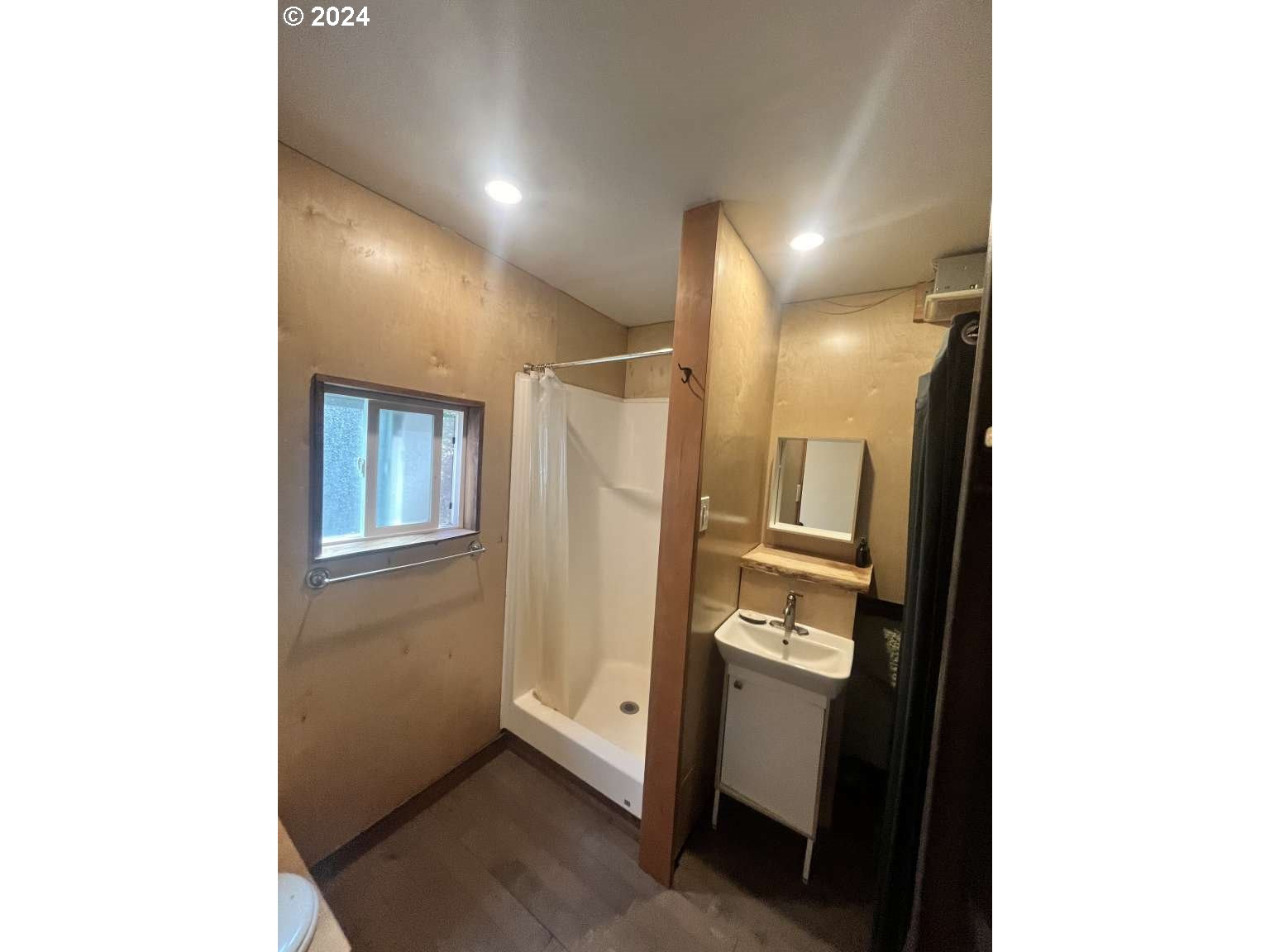 189 Bristol Road White Salmon, WA 98672 - Photo 11 of 11 a bathroom with a glass door shower door and a sink
