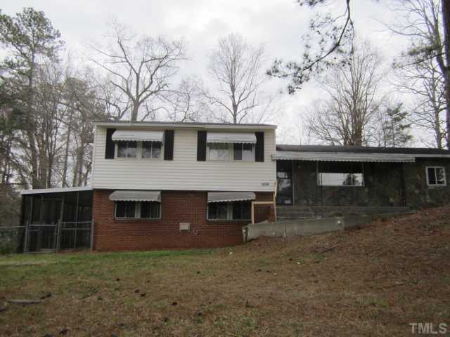 2421 Rock Quarry Road Raleigh, NC 27610 - Photo 1 of 10 a front view of a house with garage