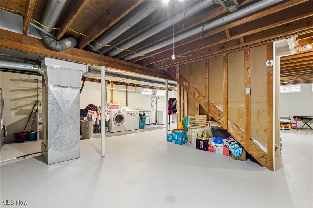 445 Center Road Hinckley, OH 44233 - Photo 35 of 50 Below grade area with heating unit and washer and dryer