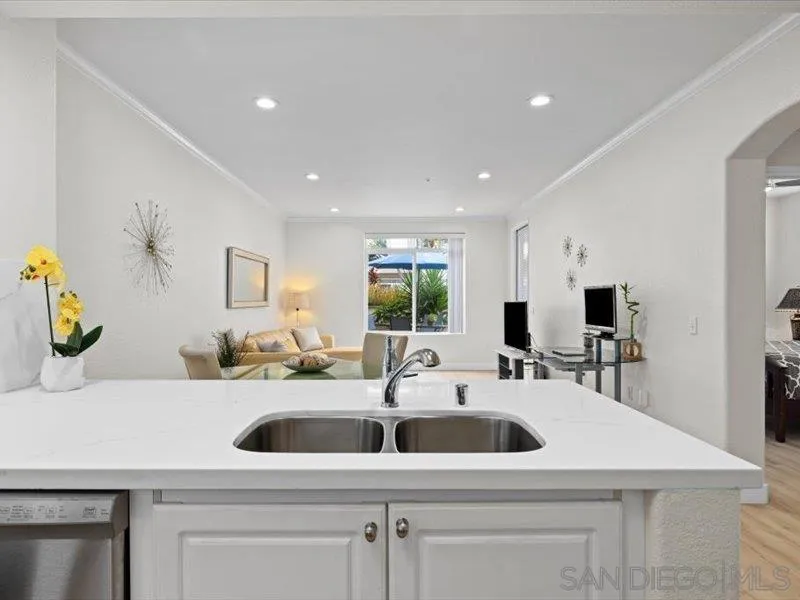 9237 Regents Road, Unit K101 La Jolla, CA 92037 - Photo 4 of 29 a kitchen with a sink a counter top space and a window