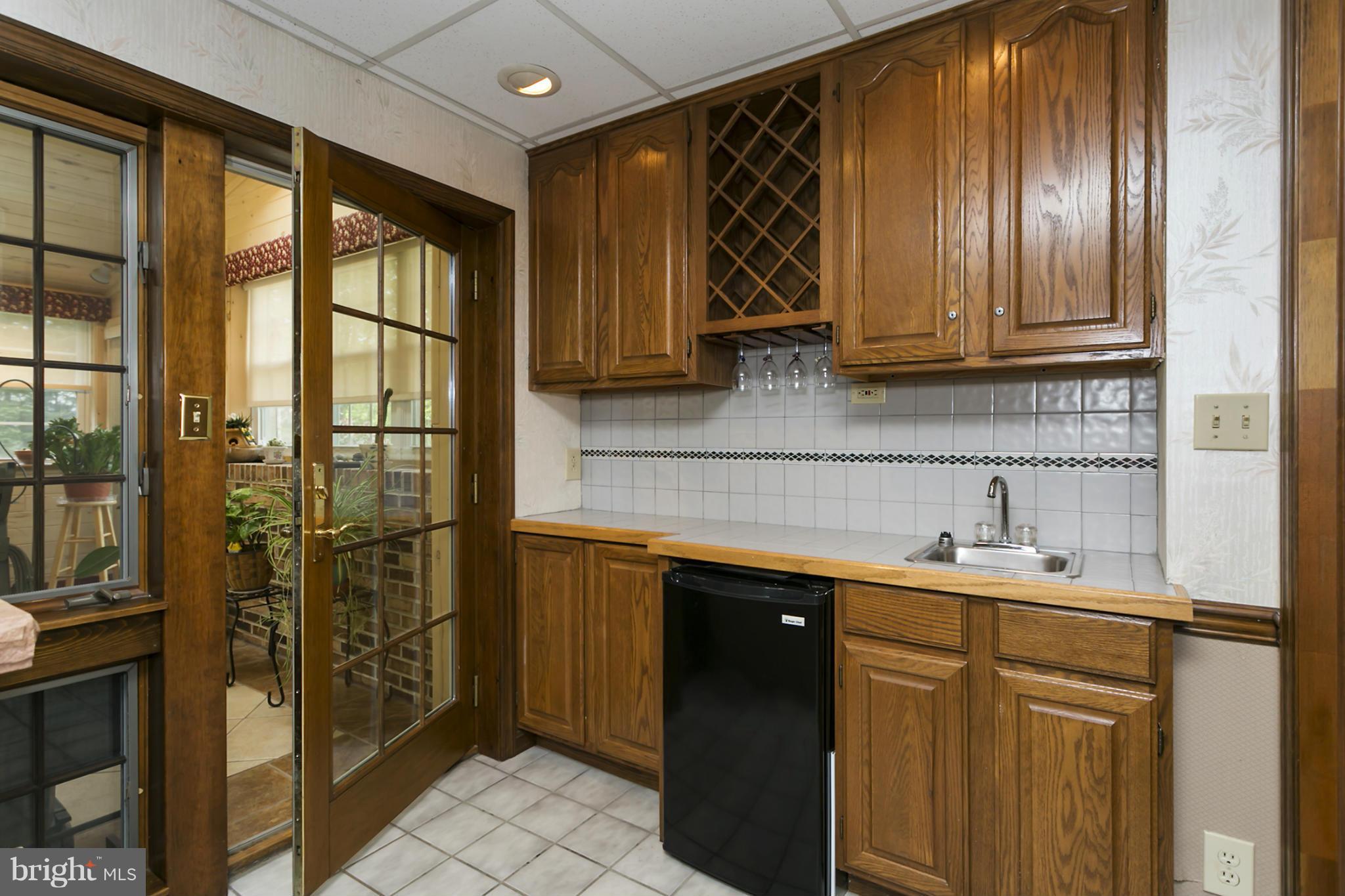 10009 German Road Ellicott City, MD 21042 - Photo 17 of 27 a kitchen with a sink and a refrigerator