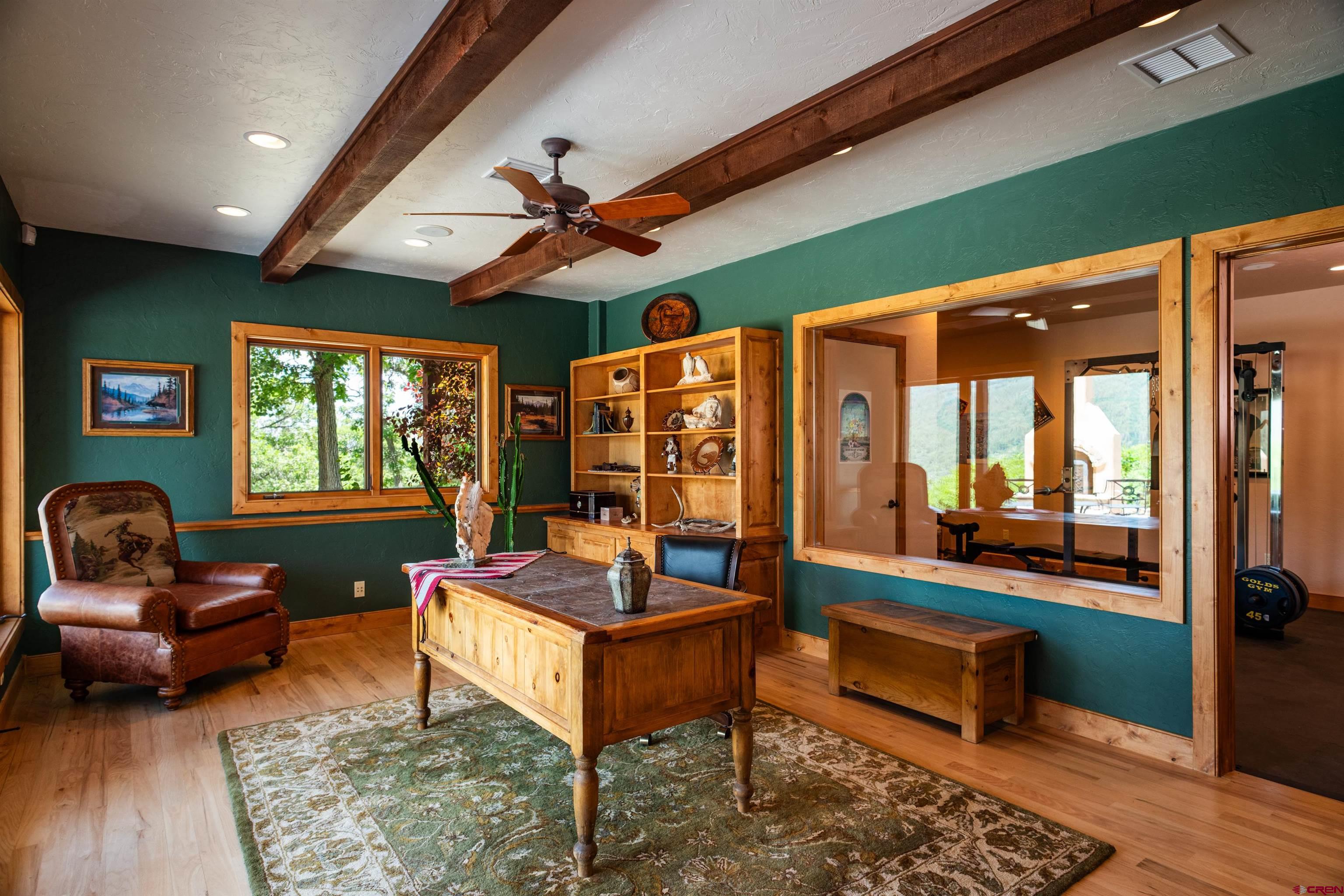 2550 Destination Ranch Road Durango, CO 81301 - Photo 18 of 45 a living room with furniture a rug and a large window