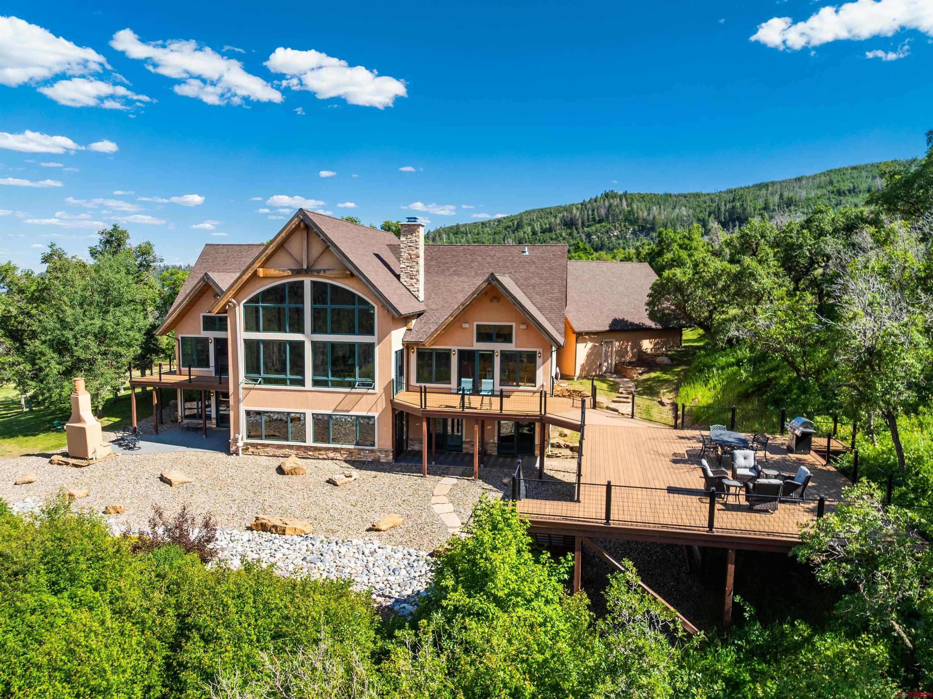 2550 Destination Ranch Road Durango, CO 81301 - Photo 2 of 45 a front view of a house with a yard