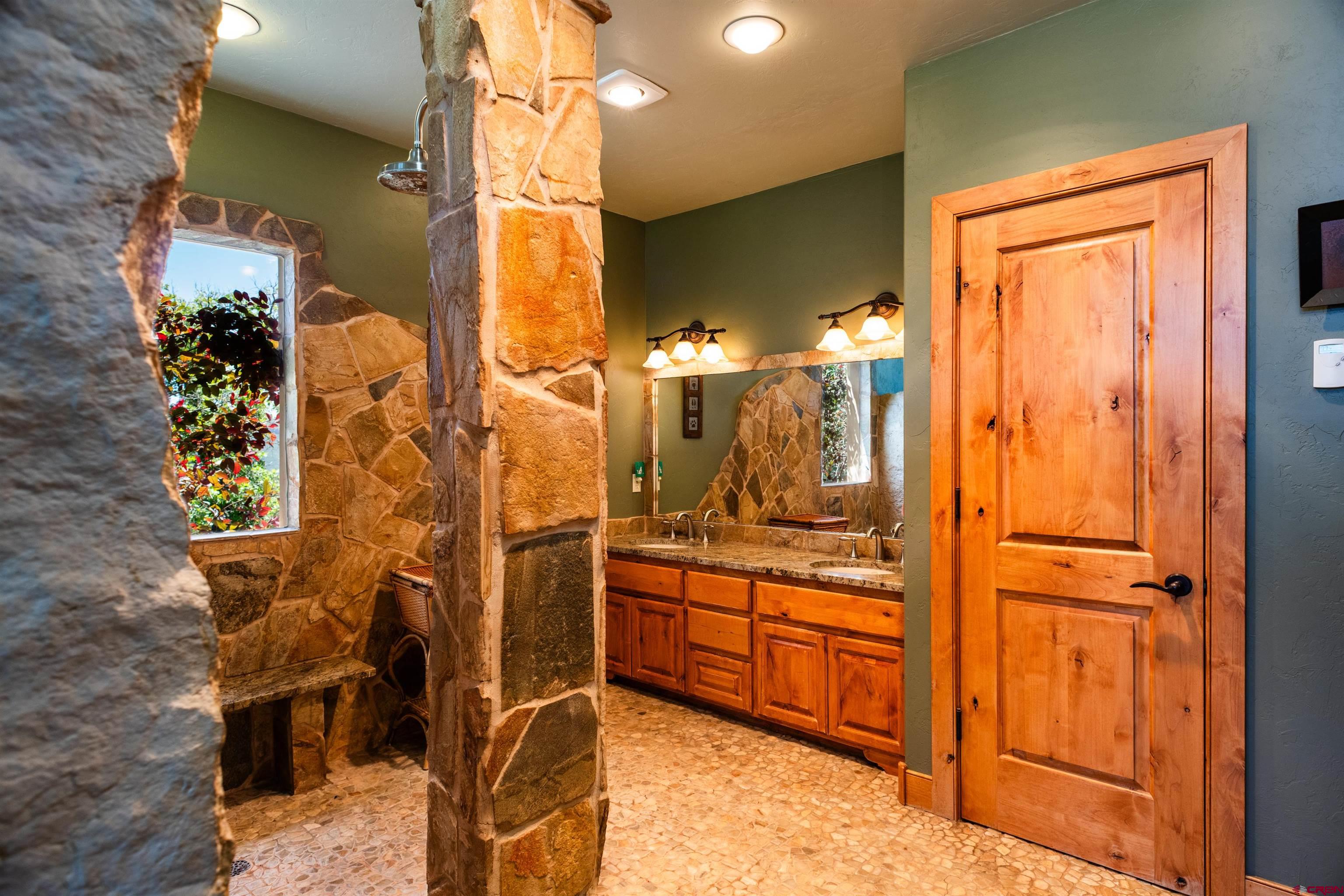 2550 Destination Ranch Road Durango, CO 81301 - Photo 22 of 45 a bathroom with a sink and mirror