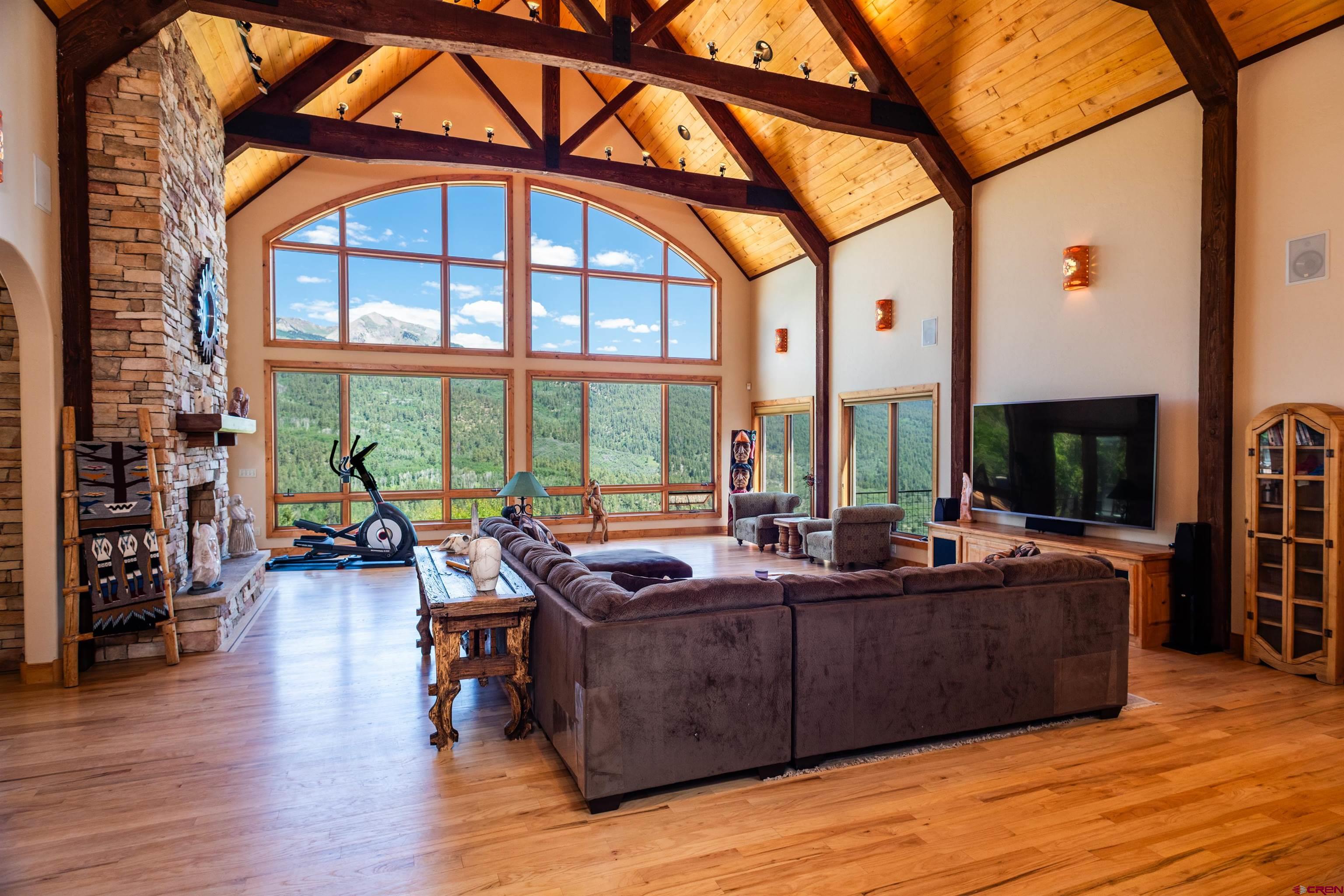 2550 Destination Ranch Road Durango, CO 81301 - Photo 29 of 45 a living room with furniture and a floor to ceiling window