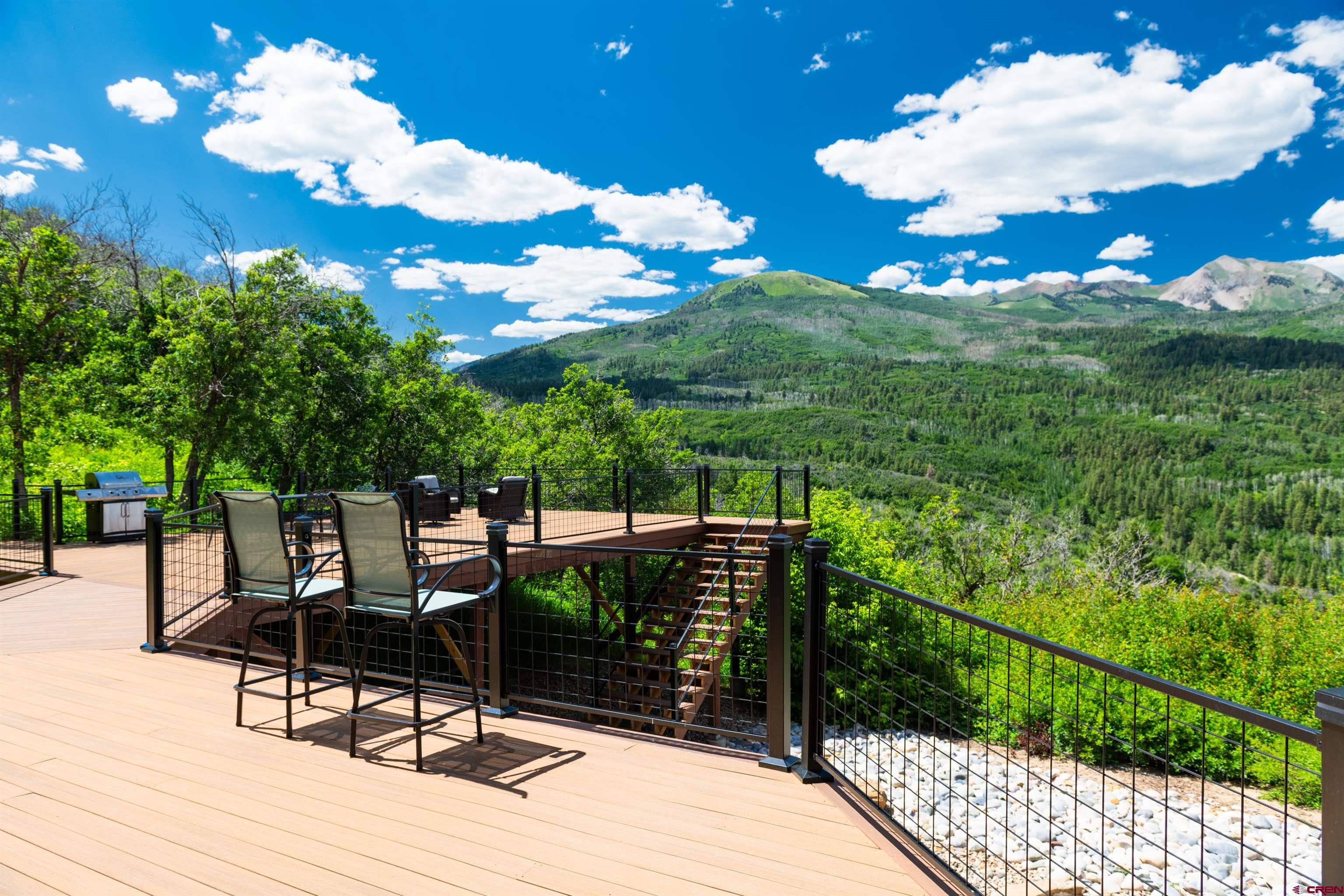 2550 Destination Ranch Road Durango, CO 81301 - Photo 33 of 45 a view of a balcony with chair and tables