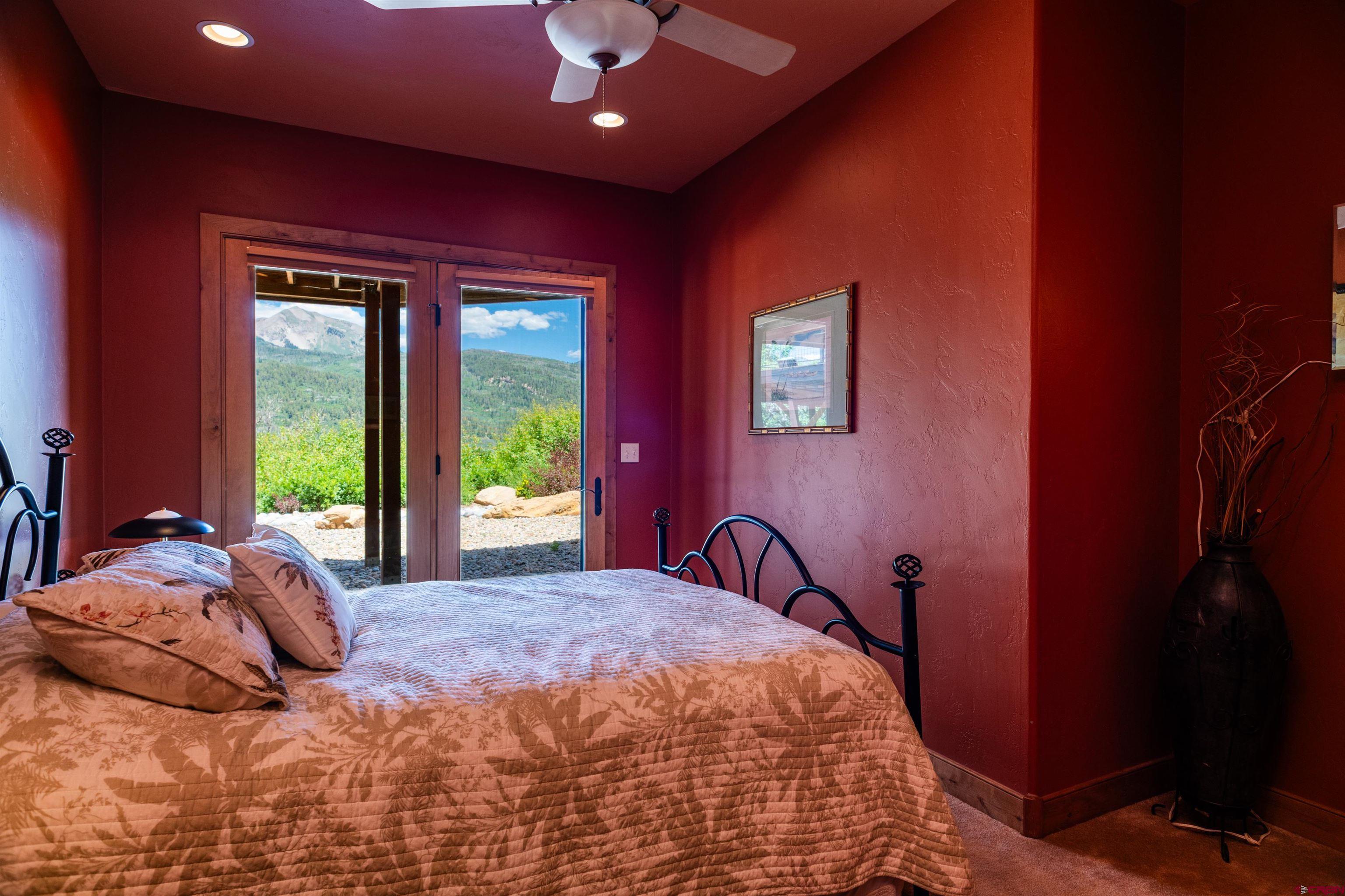 2550 Destination Ranch Road Durango, CO 81301 - Photo 38 of 45 a bed sitting in a spacious bedroom next to a window