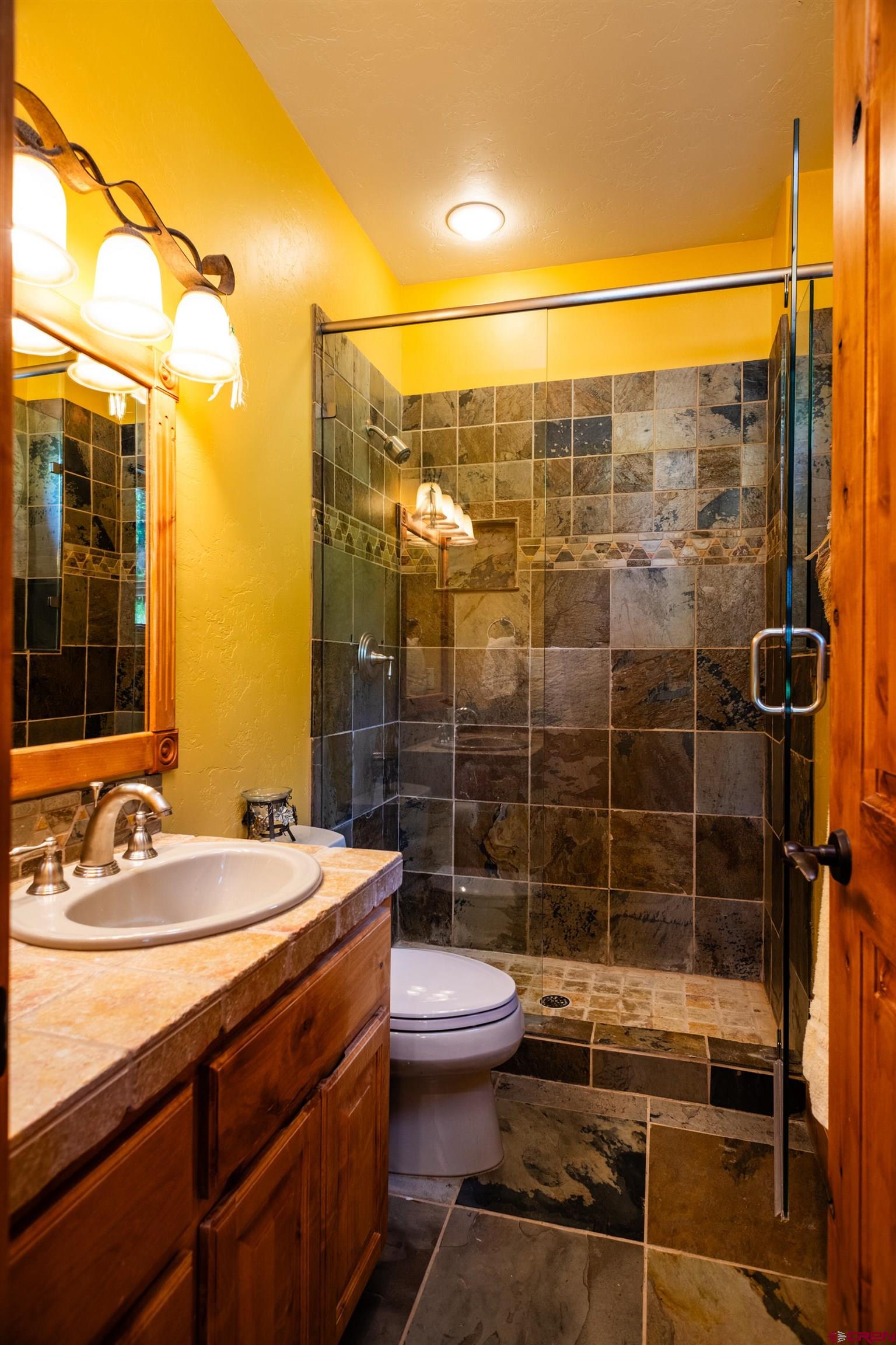 2550 Destination Ranch Road Durango, CO 81301 - Photo 40 of 45 a bathroom with a sink toilet and shower