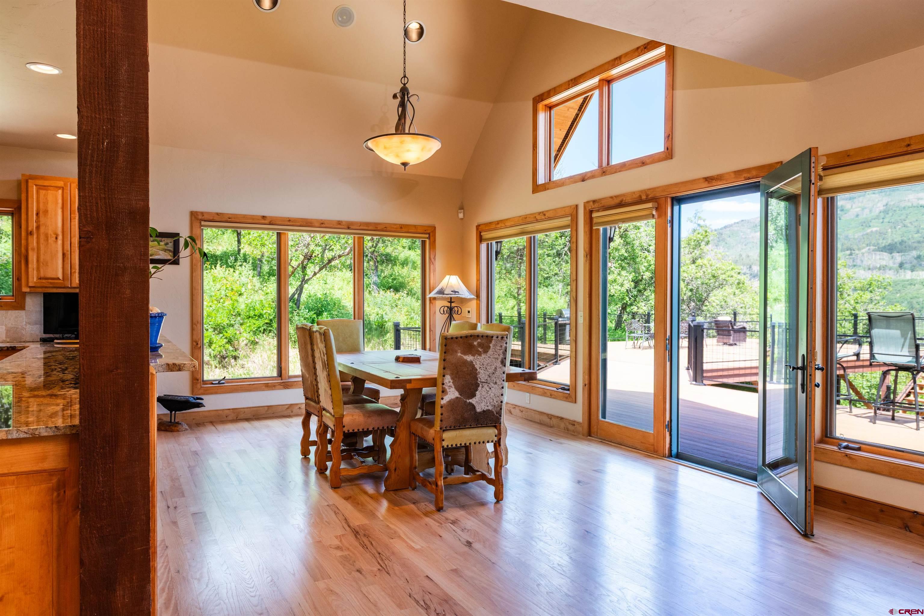 2550 Destination Ranch Road Durango, CO 81301 - Photo 5 of 45 a view of a dining room with furniture window and wooden floor