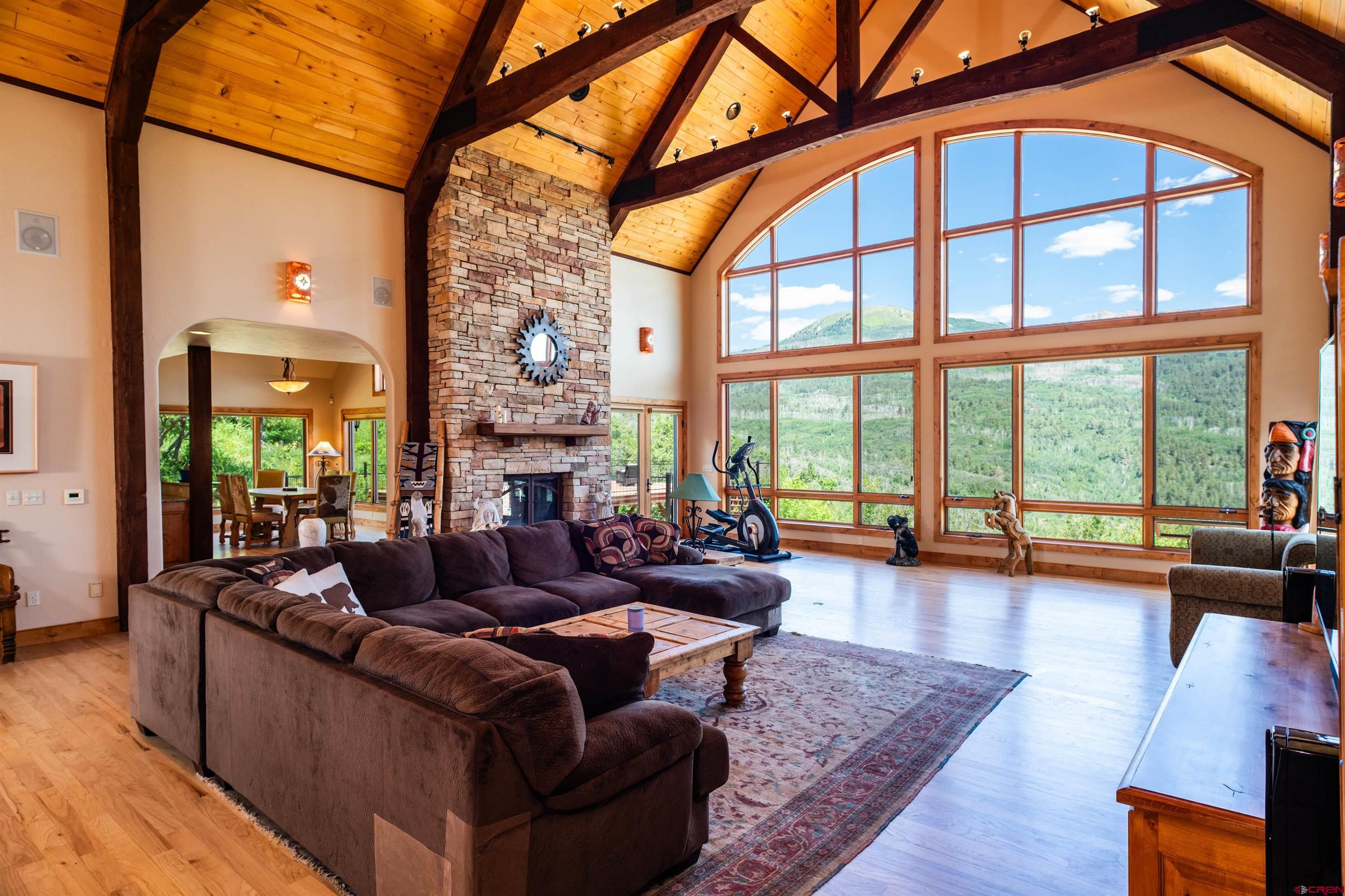 2550 Destination Ranch Road Durango, CO 81301 - Photo 5 of 45 a living room with fireplace furniture and a large window