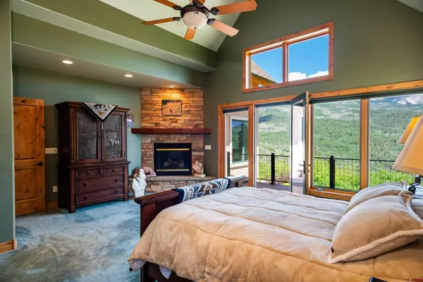 a living room with furniture a pool table and a large window