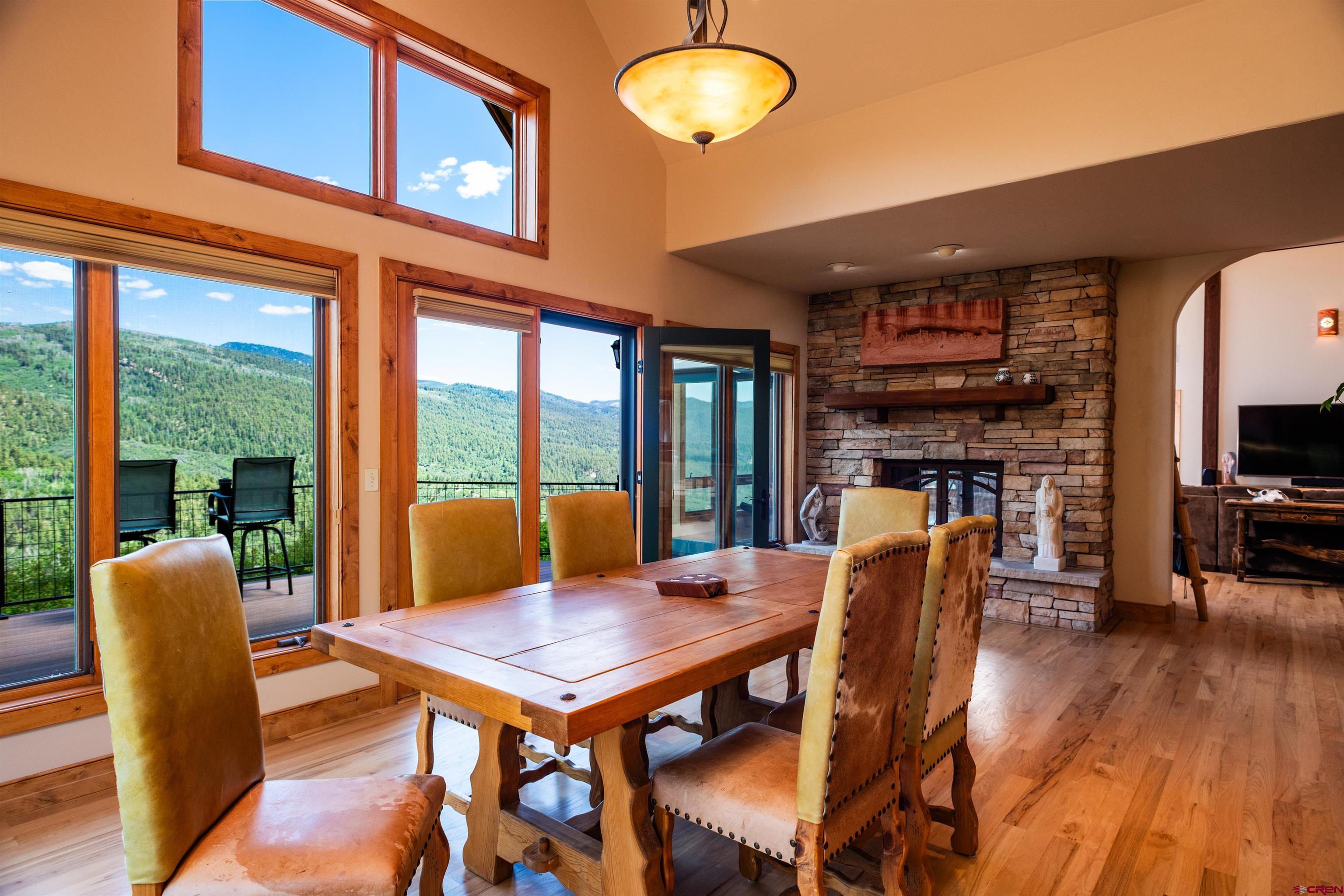 2550 Destination Ranch Road Durango, CO 81301 - Photo 8 of 45 a view of a dining room with furniture window and wooden floor
