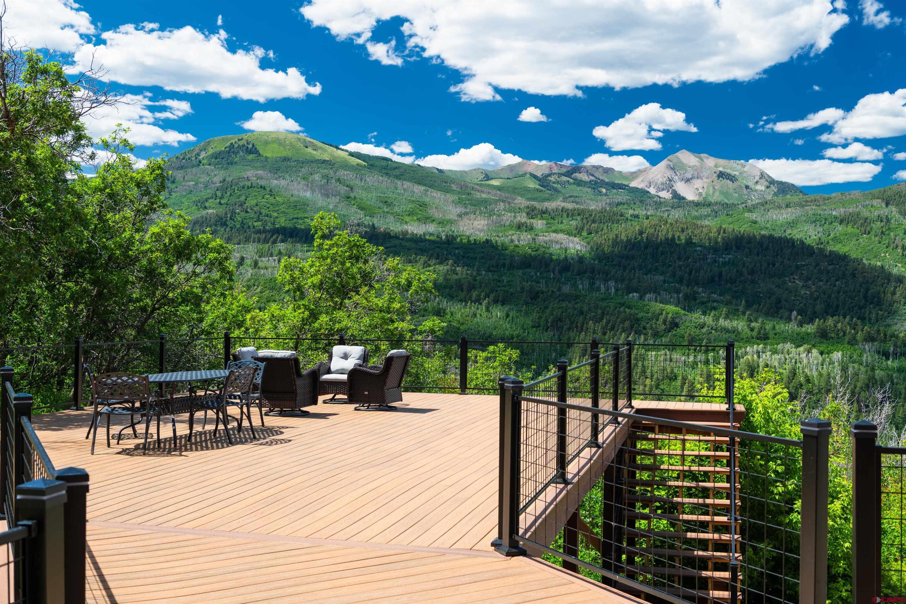 2550 Destination Ranch Road Durango, CO 81301 - Photo 10 of 45 a view of a patio with table and chairs and potted plants