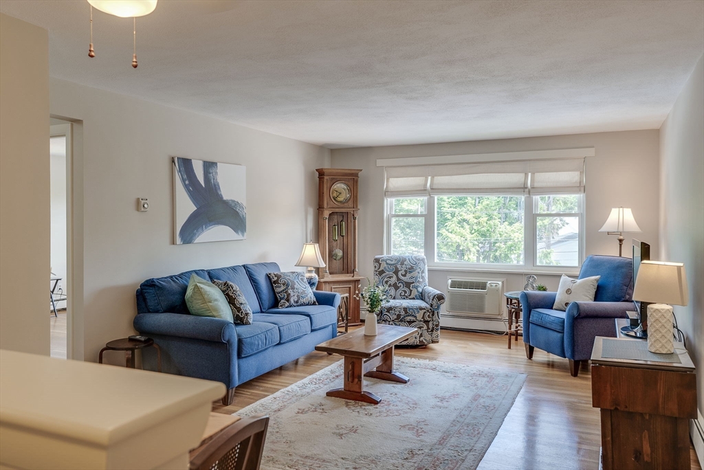 36 Whitman Road, Unit 24 Waltham, MA 02453 - Photo 4 of 14 a living room with furniture and a large window