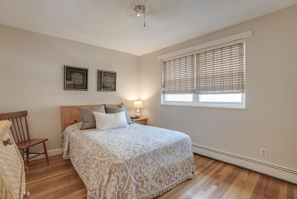 36 Whitman Road, Unit 24 Waltham, MA 02453 - Photo 8 of 14 a bedroom with a bed and a window