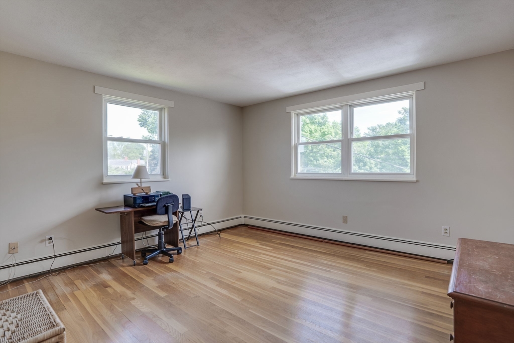 36 Whitman Road, Unit 24 Waltham, MA 02453 - Photo 9 of 14 a view of room with wooden floor and windows