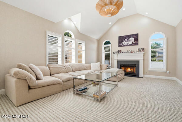 54 Georgetown Road Eatontown, NJ 07724 - Photo 9 of 24 a living room with furniture a fireplace and a large window
