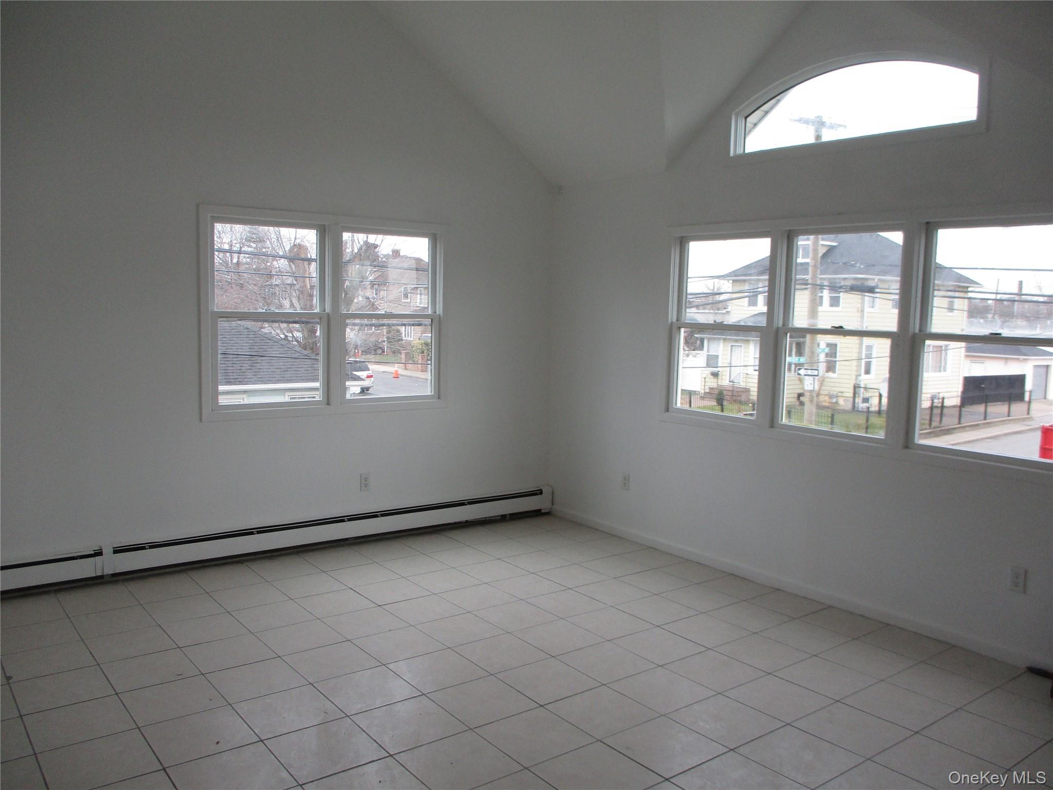 94 Roger Avenue Inwood, NY 11096 - Photo 5 of 19 an empty room with a window