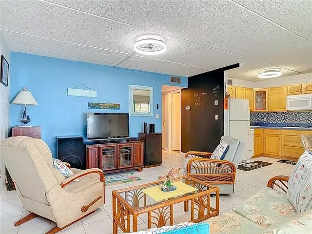 a dining hall with a dining table and chairs