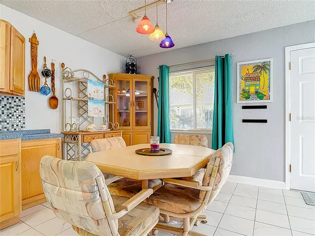 a white refrigerator freezer sitting inside of a kitchen