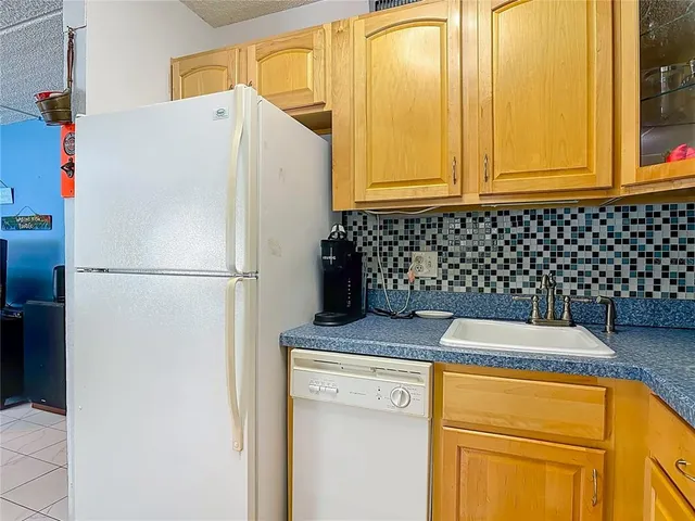 a bedroom with a bed and a mirror