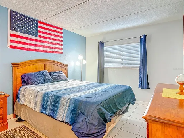 a bedroom with a bed and a closet