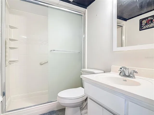 a utility room with cabinets washer and dryer