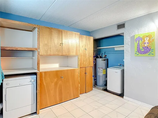 an aerial view of residential building with parking