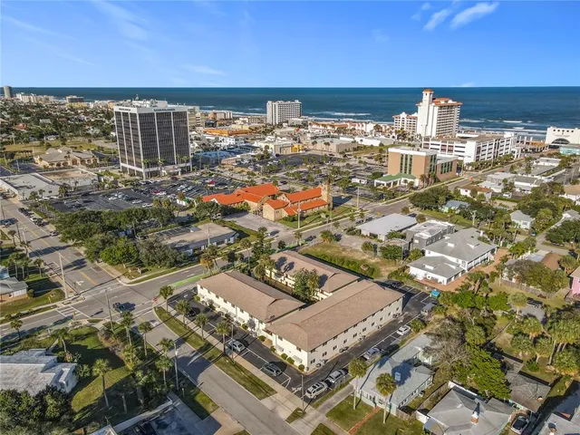 an aerial view of residential building and lake