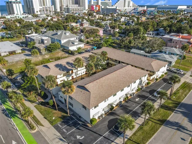 an aerial view of residential houses with outdoor space