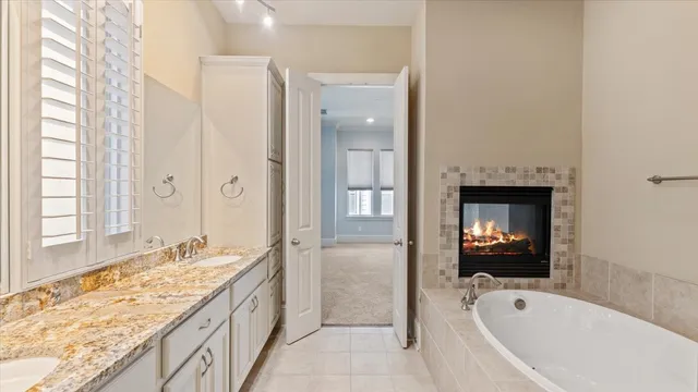 a bathroom with a tub and a shower