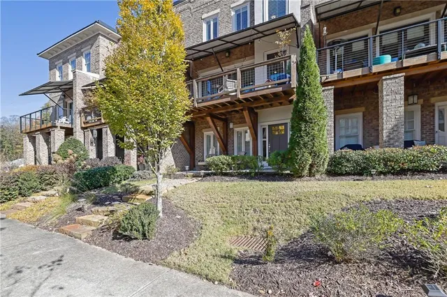 a view of a building with a yard