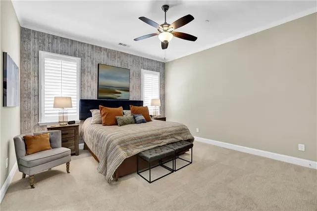 a bedroom with a bed couch and window