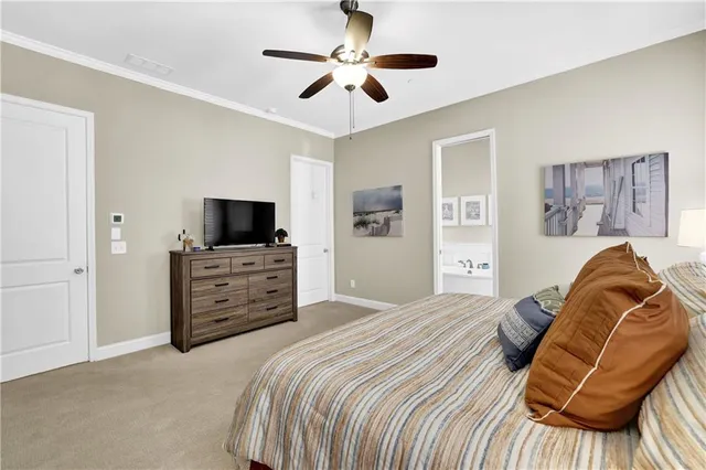 a white bath tub sitting next to a bathroom sink
