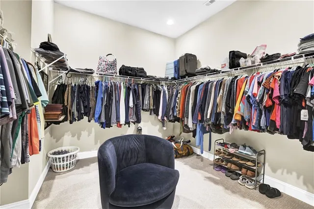 a view of a building with sitting area and furniture