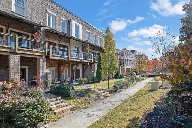 front view of a brick house with a street