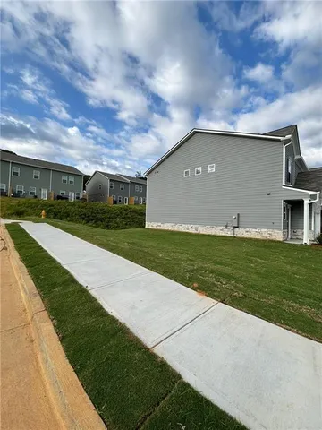 a backyard of a house with lots of green space