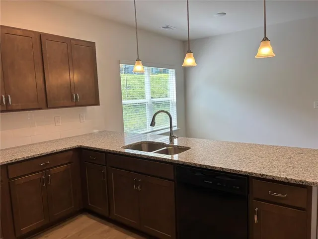 a large kitchen with a large island in the center