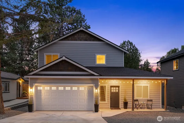 a front view of a house with a garage