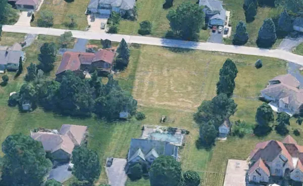 an aerial view of a house with outdoor space swimming pool and lake view