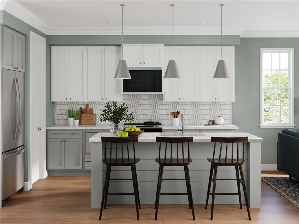 4014 Benton Way Bridgeville, PA 15017 - Photo 3 of 18 a kitchen with a table chairs refrigerator and cabinets
