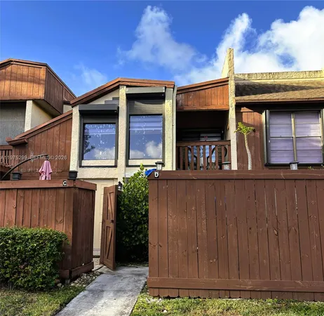 a view of a car park in front of house