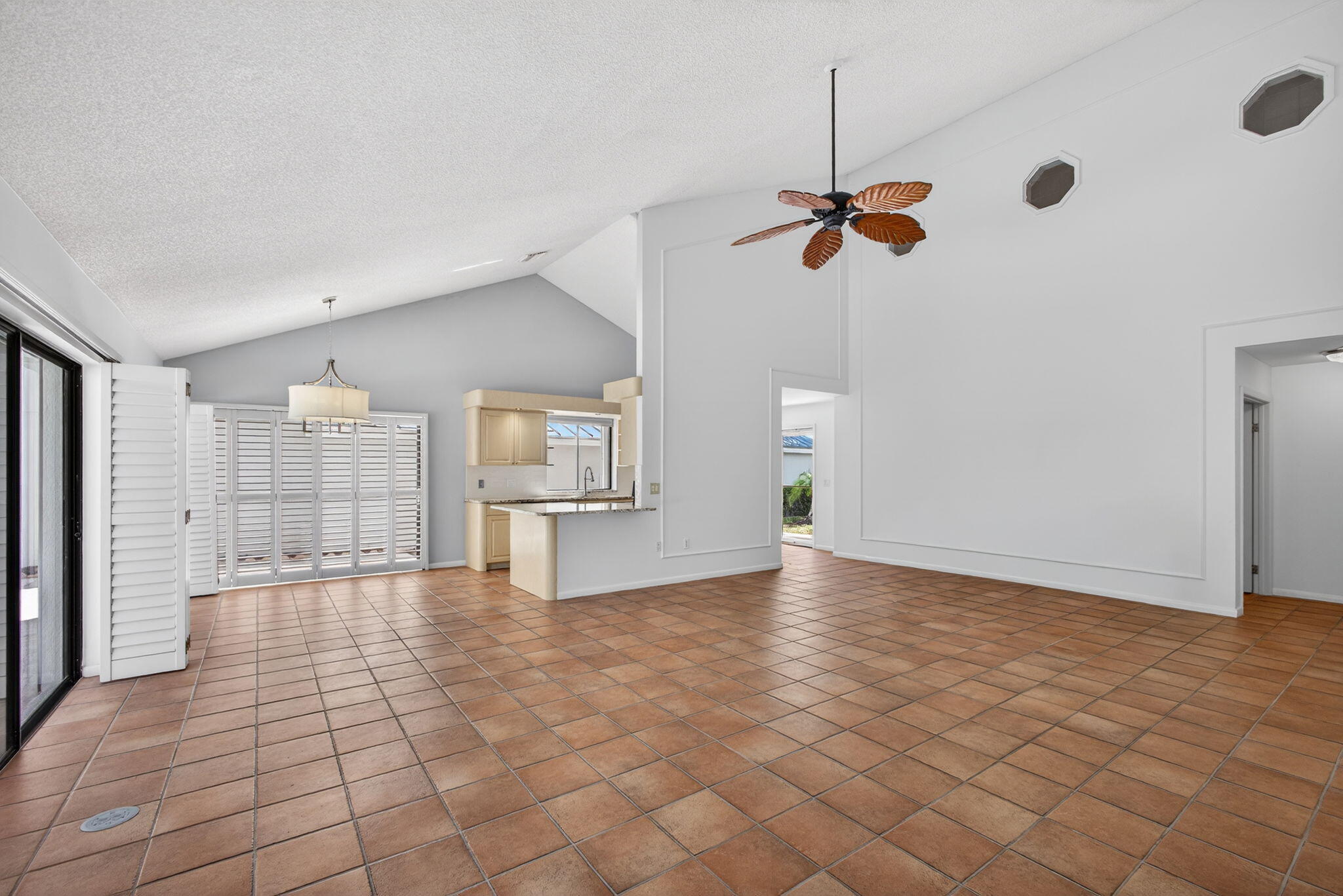 239 Ridge Road Jupiter, FL 33477 - Photo 17 of 75 a view of a kitchen with a sink and a chandelier fan