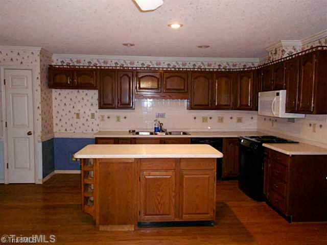 7905 Grey Fox Road Oak Ridge, NC 27310 - Photo 2 of 16 Kitchen. Kitchen with Island