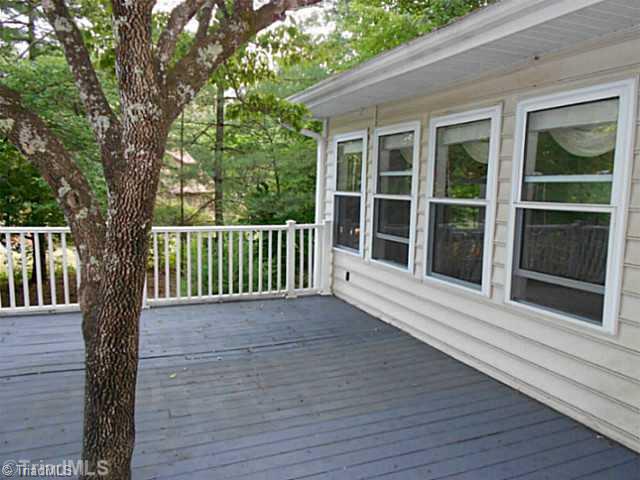 7905 Grey Fox Road Oak Ridge, NC 27310 - Photo 14 of 16 Patio/Deck. Deck next to Sunroom