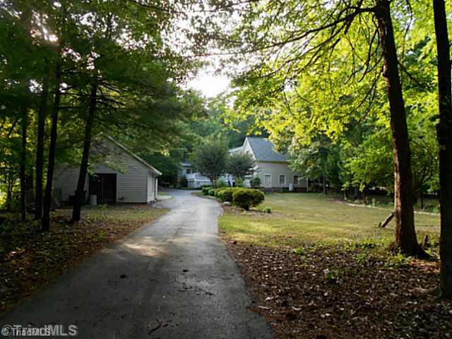 7905 Grey Fox Road Oak Ridge, NC 27310 - Photo 16 of 16 Exterior Back. Back View with private driveway