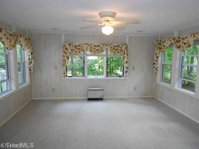 7905 Grey Fox Road Oak Ridge, NC 27310 - Photo 3 of 16 Sunroom. Large Sunroom